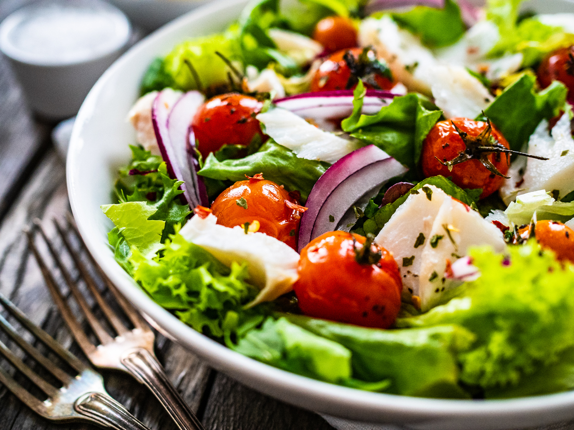 Roast fish and vegetable salad on wooden background Assisted Living, Independent Living, & Memory Care Excellence in Silver Lake | AVIVA River Bend